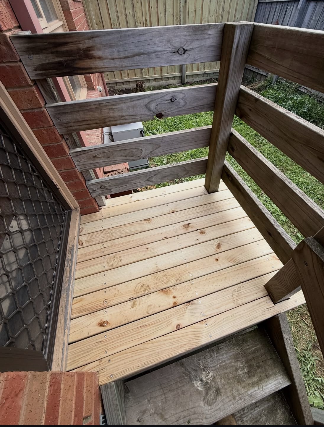 Replacement decking boards installed on a small outdoor landing